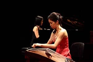 Guzheng Teacher Cen Hai Shan in concert playing guzheng